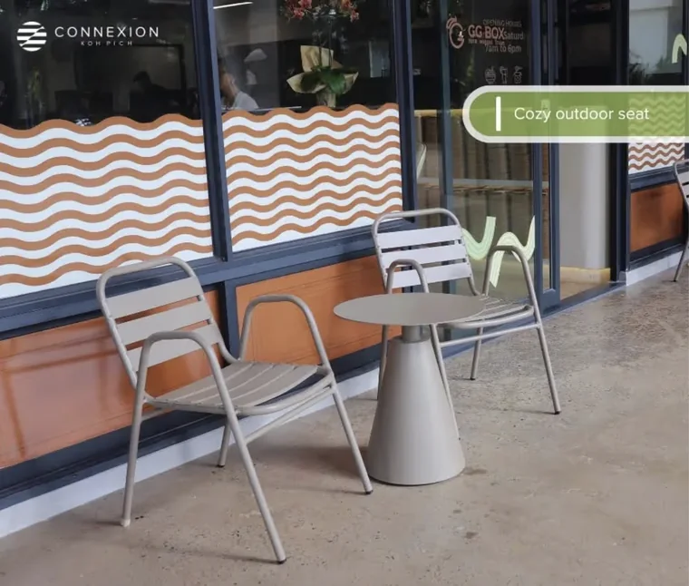Outdoor café seating in front of GG Box at Connexion