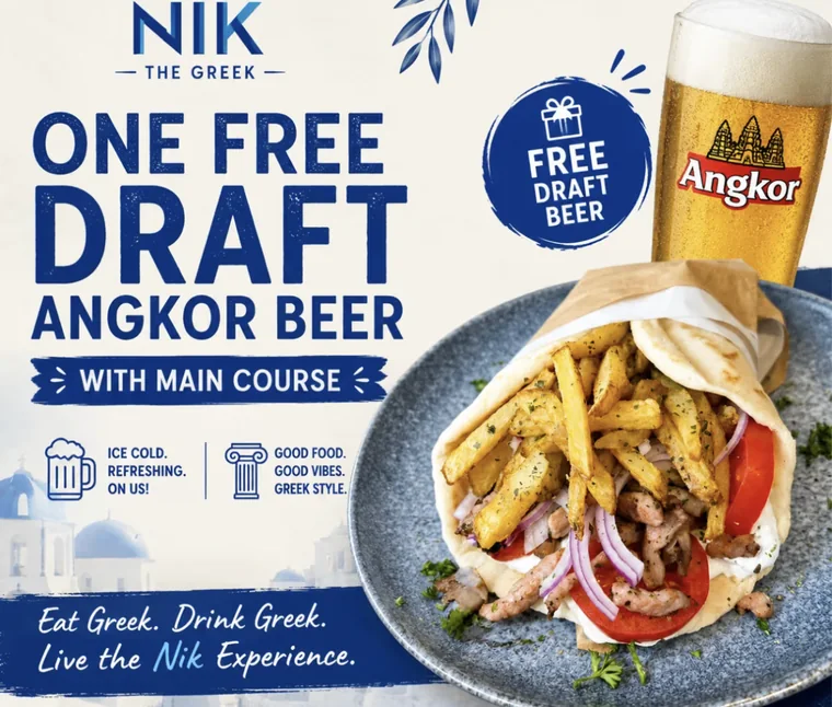 Gyro with fries next to a glass of Angkor beer