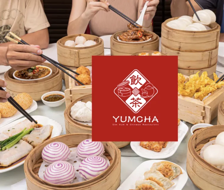 Table of dim sum baskets with the Yumcha logo